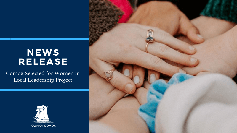 Several hands clasped over top of each other