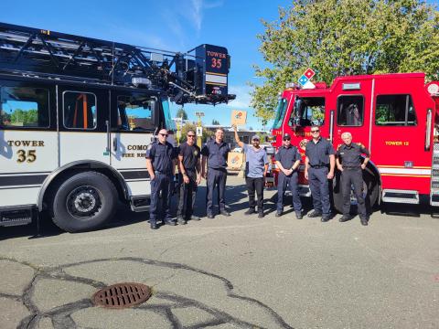 Image of local fire trucks and firefighters