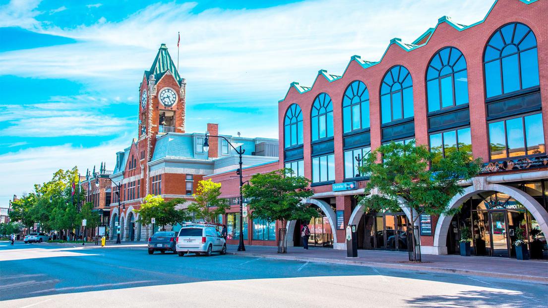A downtown street with a clock tower